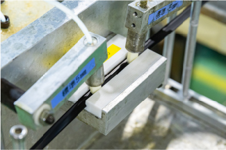 インラインでの加工自動化で目標コスト達成